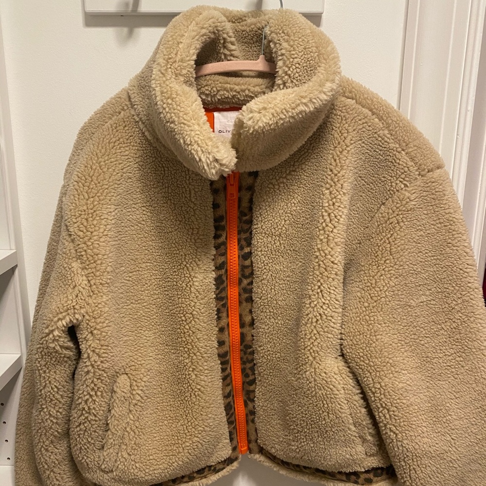 Teddy coat with orange zipper and cheetah detail